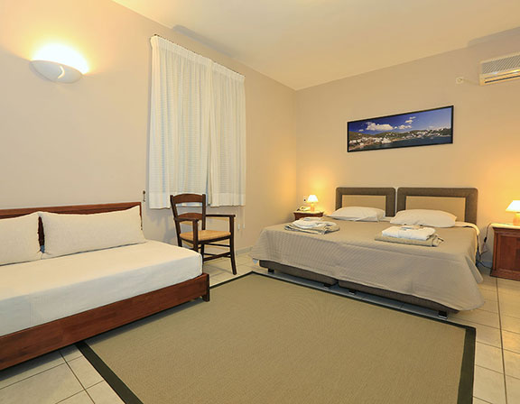 Superior room with double bed and sofa